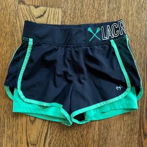 Lacrosse shorts with short leggings underneath
